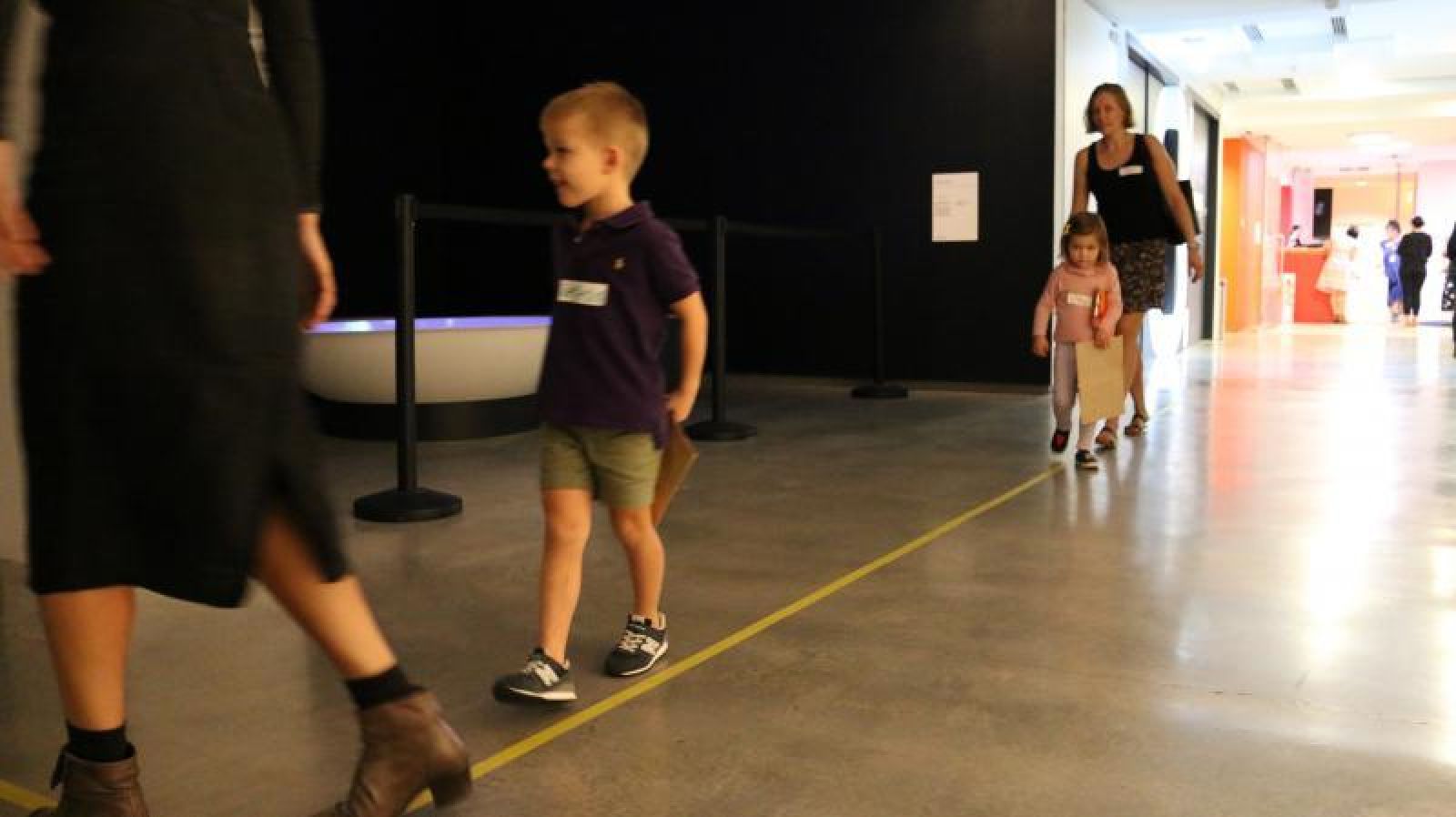 Children-walking-on-yellow-line